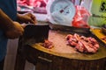 Butcher chopping meat at Tekka Centre