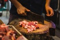 Butcher chopping meat at Tekka Centre