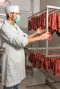 Butcher controls sausage Royalty Free Stock Photo