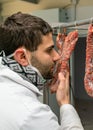 Butcher controls sausage Royalty Free Stock Photo