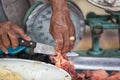 Butcher cutting meat in Otavalo, Ecuador