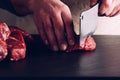 Butcher hands close up: cutting meet close up