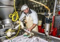 Butcher prepares fresh sausage