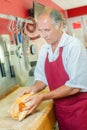 Butcher preparing a chicken