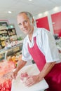 Butcher preparing joint beef in shop