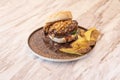 Butcher\'s burger with a good piece of meat covered with barbecue sauce with crunchy onion and potato wedges garnish