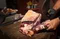 Butcher's shop. Italian Chianina meat. Cut with a knife.