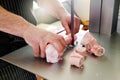 Butcher sawing marrow bones from a calf femur