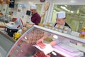 butcher standing behind counter Royalty Free Stock Photo