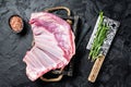 Butcher table with Rack of lamb, raw mutton ribs with meat cleaver. Black background. Top view Royalty Free Stock Photo