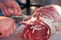 Butcher tying meat