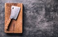 Butcher. Vintage butcher meat cleavers with cloth towel on dark concrete or wooden kitchen board