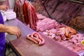 Butcher working with sausage serving customers Royalty Free Stock Photo