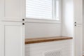 Butcherblock Sustainable Wood Bench Shelf with Shiplap Paneling and White Cabinets with Window Above