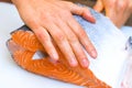 Butchering salmon, piece of salmon red fish meat