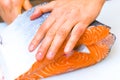 Butchering salmon, piece of salmon red fish meat