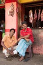 Butchers posing in front of street butchery shop