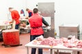 Butchers preparing fresh meat peaces for sale at market Royalty Free Stock Photo