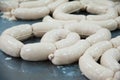 Butchers processing sausages at meat factory Royalty Free Stock Photo