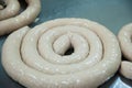 Butchers processing sausages at meat factory Royalty Free Stock Photo