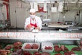 Butchery salesman is serving a customer with meat Royalty Free Stock Photo
