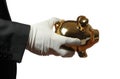 Butler with white glove an golden piggybank