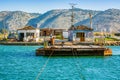 Butrint, Albania - August 05, 2014. Basic wooden ferry for vehicles