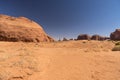 Butte, sand and scrub in Monument Valley Arizona Royalty Free Stock Photo