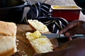 Butter being spread on white bread Royalty Free Stock Photo