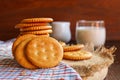 butter biscuits cracker and milk set up on napkin and wooden background Royalty Free Stock Photo