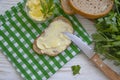 Butter, bread, parsley natural kitchen on a wooden background Royalty Free Stock Photo