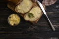 Butter, bread, parsley traditional   on a wooden background sliced Royalty Free Stock Photo