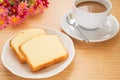 Butter cake sliced on plate and coffee cup Royalty Free Stock Photo