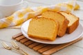 Butter cake sliced on white plate and cup of coffee Royalty Free Stock Photo