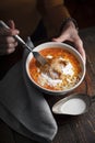 Butter chicken and a woman on a dark background partial blur