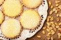 Butter cookies (alfajores) with caramel and peanut on wooden background. Royalty Free Stock Photo