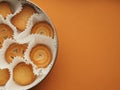 Butter cookies packaged. on orange background. Royalty Free Stock Photo