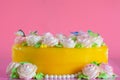 Butter cream of Pink Roses decorated on orange pond cake on pink background with copy space served in Birthday Party and wedding. Royalty Free Stock Photo