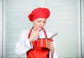 Butter cream. Use hand whisk. Woman chef hold whisk and pot. Girl in apron whipping eggs or cream. Start slowly whisking Royalty Free Stock Photo