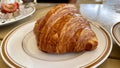 Butter Croissant on white ceramic plate