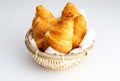 Butter croissants in small wicker basket. Aerial top view on c Royalty Free Stock Photo