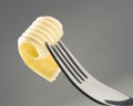 Butter curl on a fork Royalty Free Stock Photo