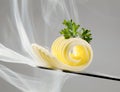 Butter curl on a knife Royalty Free Stock Photo