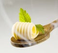 Butter curl on a wooden spoon Royalty Free Stock Photo