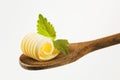 Butter curl on a wooden spoon Royalty Free Stock Photo