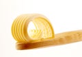 Butter curl on a wooden spoon Royalty Free Stock Photo