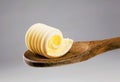 Butter curl on a wooden spoon Royalty Free Stock Photo