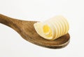 Butter curl on a wooden spoon Royalty Free Stock Photo