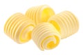 Butter curls rolled up, a group of four, isolated