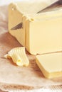Butter cutting by knife Royalty Free Stock Photo